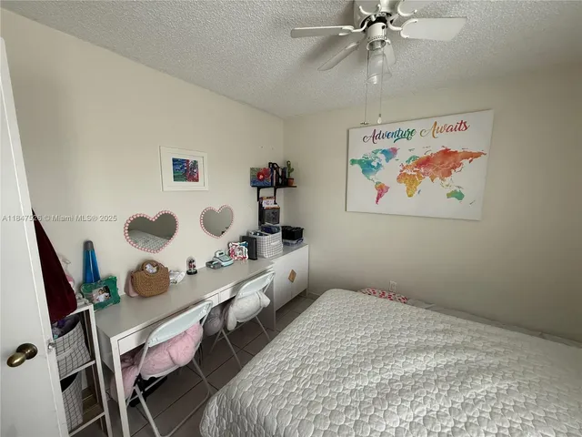 a bedroom with a bed and cabinets