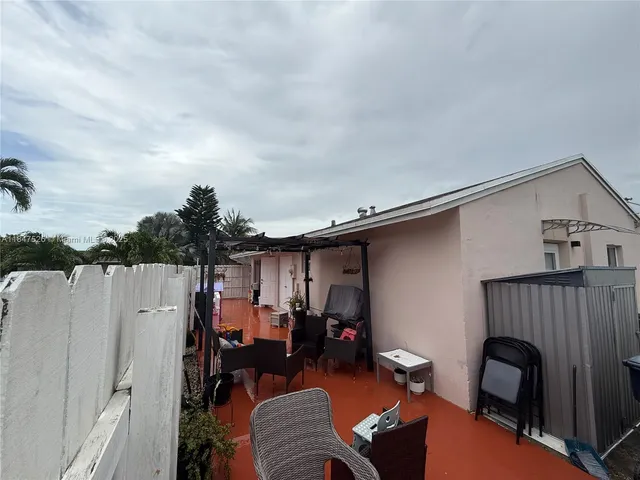 deck of the house with outdoor seating