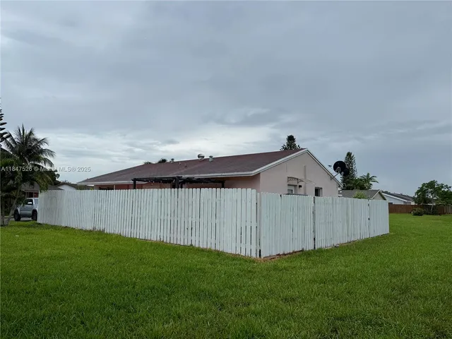 a view of a backyard with a garden and plants