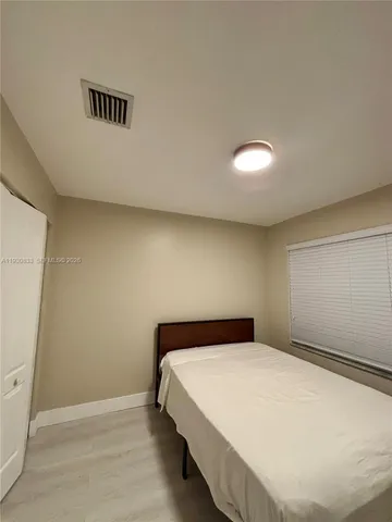 an empty room with closet area