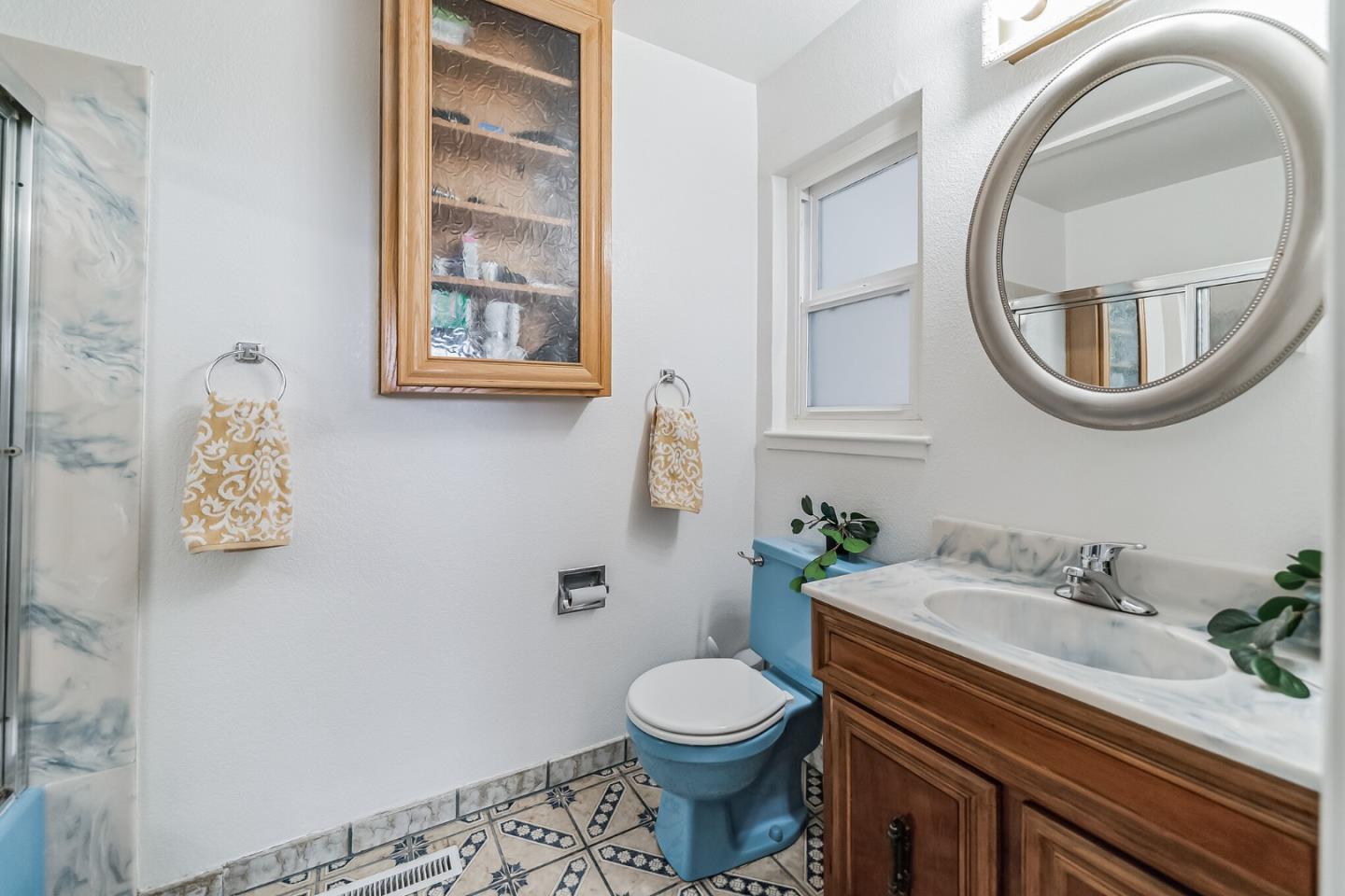 2933 Hardeman Street Hayward, CA 94541 - Photo 11 of 35 a bathroom with a sink a toilet and a mirror