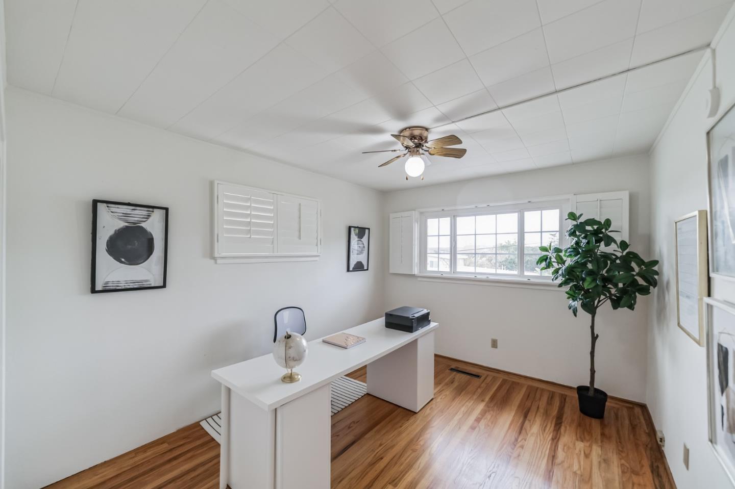 2933 Hardeman Street Hayward, CA 94541 - Photo 13 of 35 a view of a workspace with furniture and a potted plant