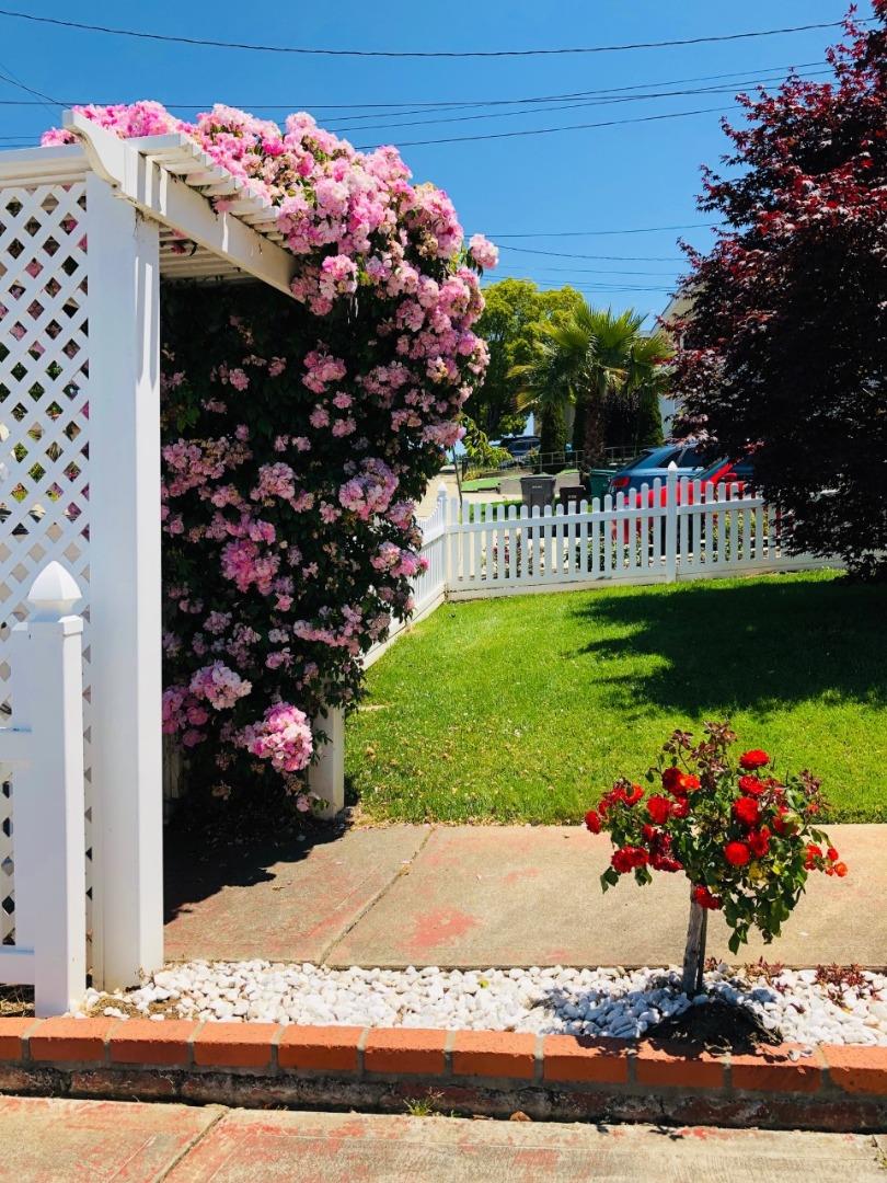 2933 Hardeman Street Hayward, CA 94541 - Photo 18 of 35 a sign that is in front of flowers