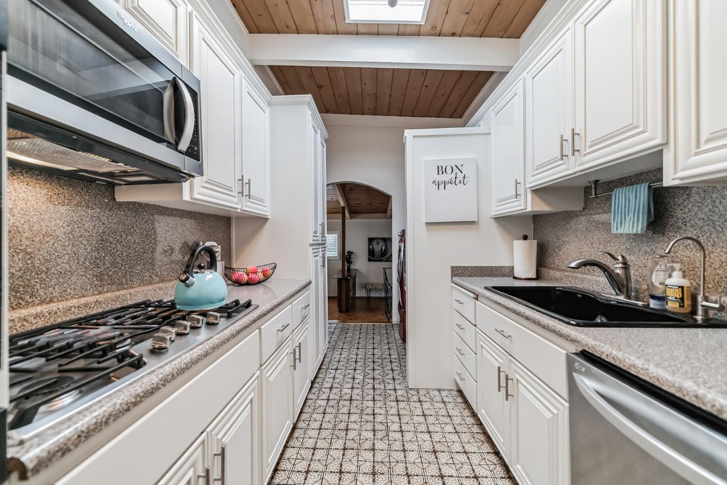 2933 Hardeman Street Hayward, CA 94541 - Photo 8 of 35 a kitchen with stainless steel appliances granite countertop a stove and a sink