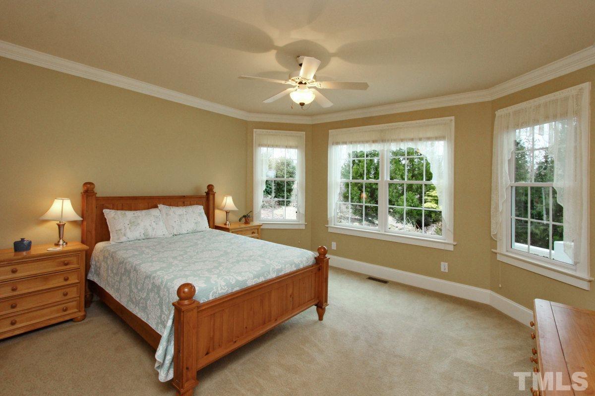 58 Lookout Ridge Pittsboro, NC 27312 - Photo 11 of 25 Main Floor Master Suite - spacious enough for the largest furniture, beautiful windows overlook the back patio and pond area.