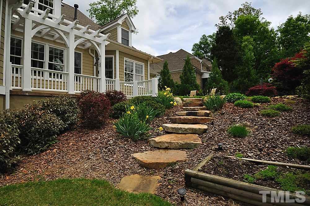 58 Lookout Ridge Pittsboro, NC 27312 - Photo 20 of 25 Just look at the extensive landscaping and outdoor entertaining areas - thoughtfully planned and beautifully designed.