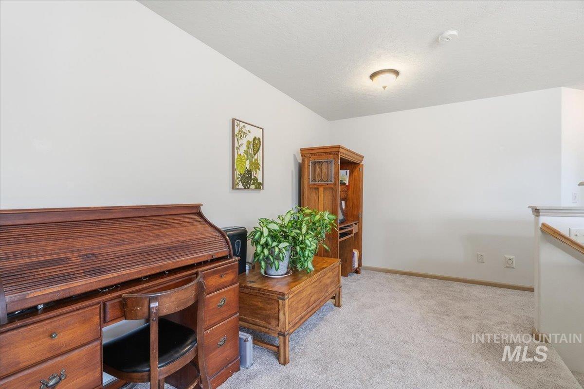 679 North Shadowfox Place Eagle, ID 83616 - Photo 23 of 37 Office area featuring light carpet and a textured ceiling