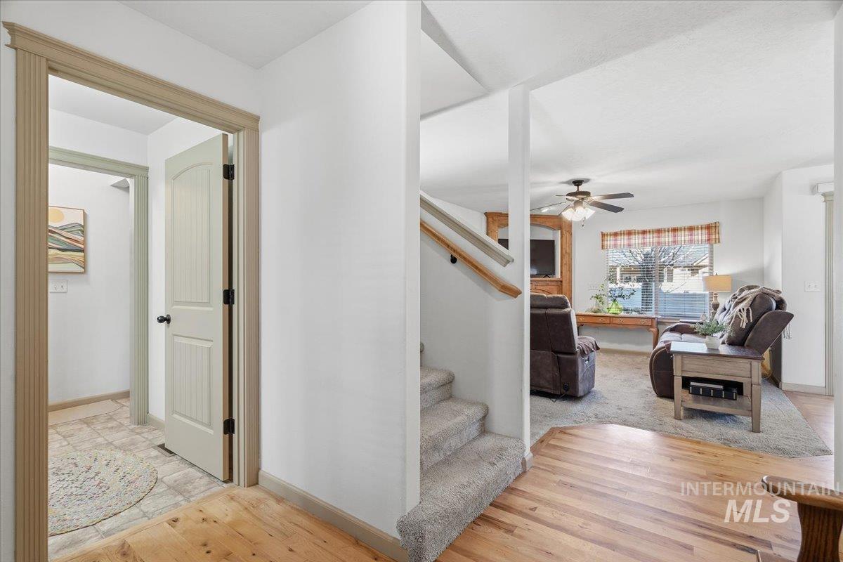 679 North Shadowfox Place Eagle, ID 83616 - Photo 10 of 28 Stairs featuring wood finished floors and ceiling fan
