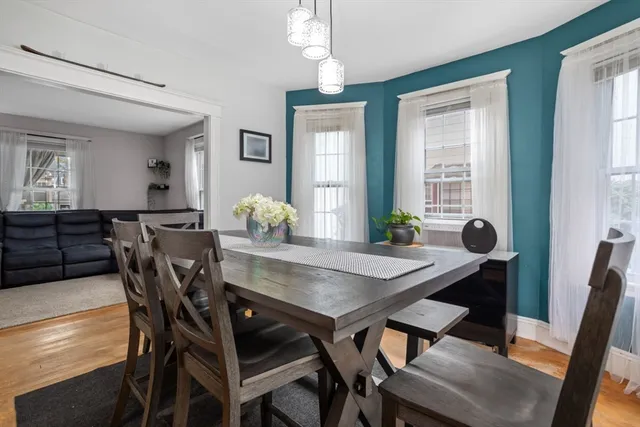 a view of a dining room with furniture and window