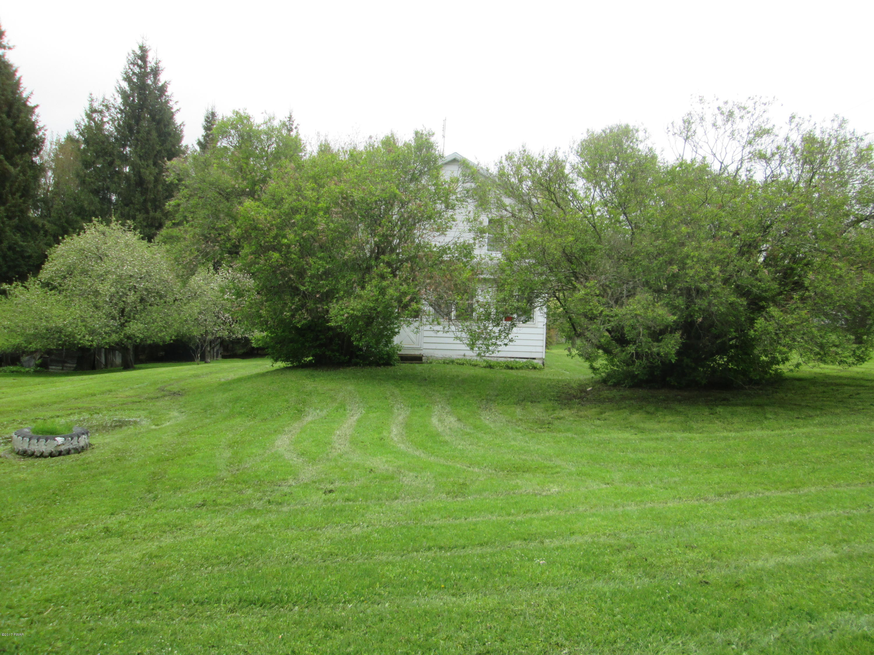 86 Beaver Hollow Road Lakewood, PA 18439 - Photo 21 of 30 a view of a green yard