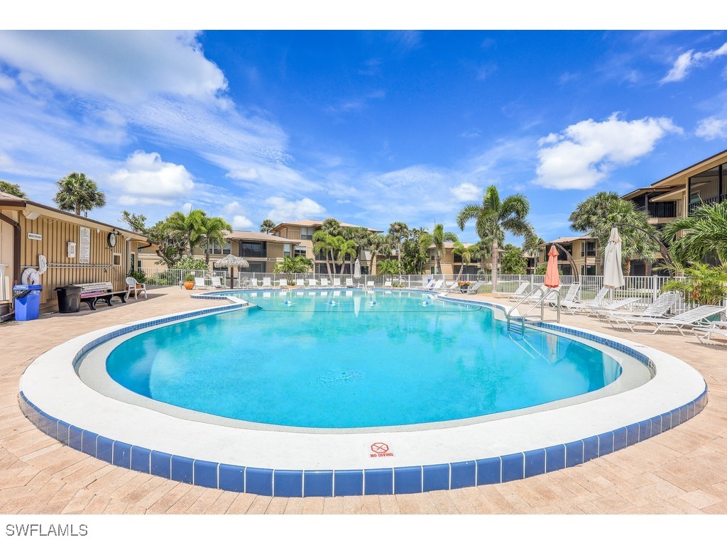 5117 Sea Bell Road, Unit B101 Sanibel, FL 33957 - Photo 17 of 23 a view of swimming pool with outdoor seating
