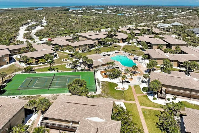 an aerial view of residential houses with outdoor space