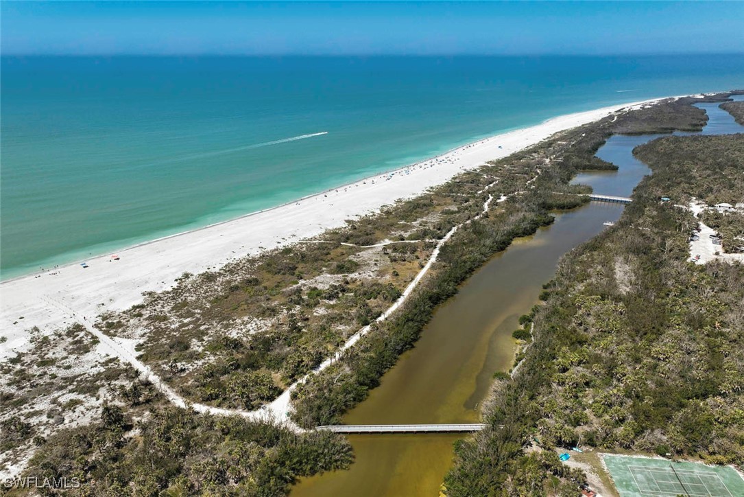5117 Sea Bell Road, Unit B101 Sanibel, FL 33957 - Photo 22 of 23 a view of an ocean and beach