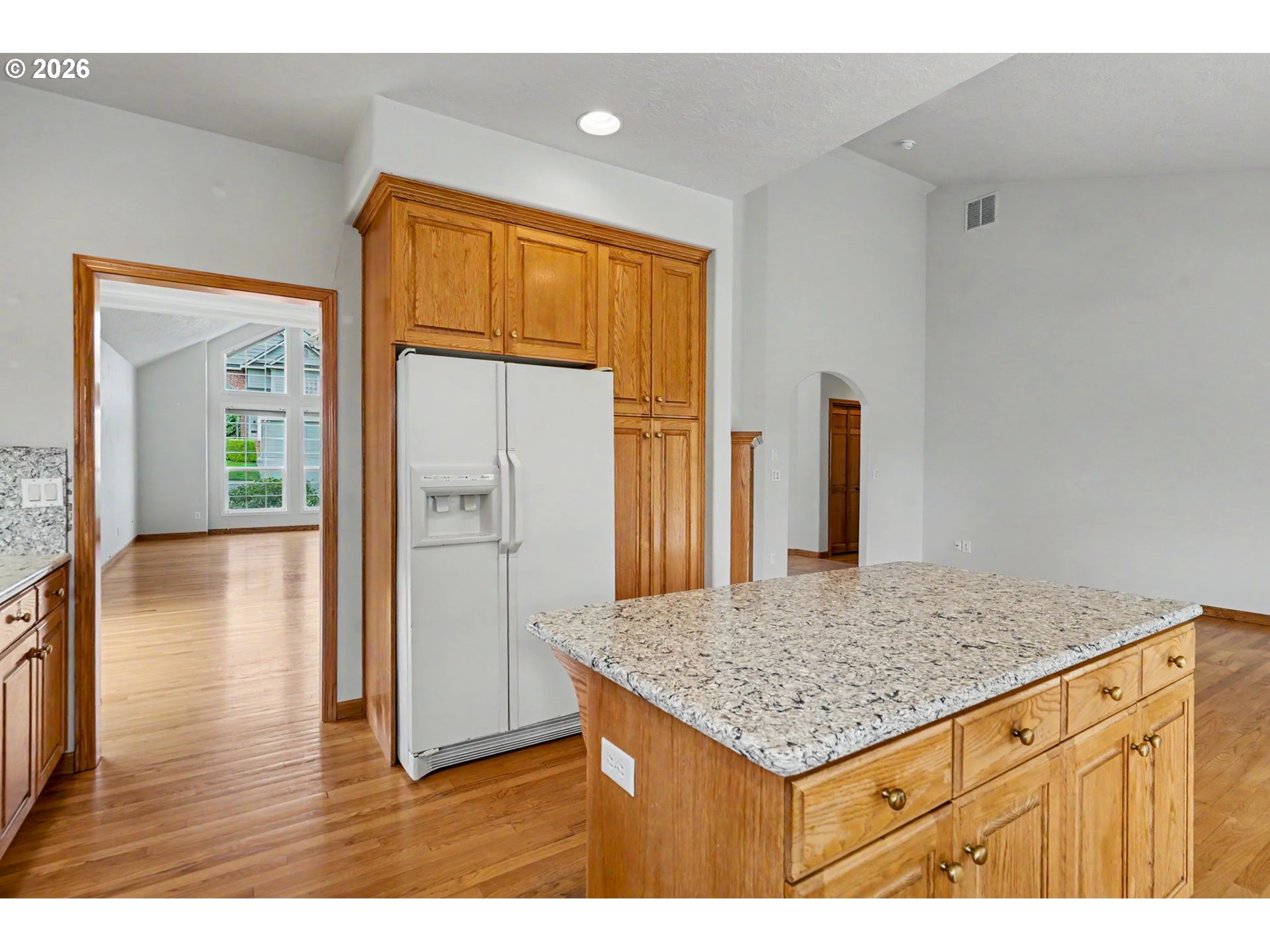 1470 Ranier Loop Northwest Salem, OR 97304 - Photo 17 of 48 a kitchen with stainless steel appliances granite countertop a refrigerator and wooden floor