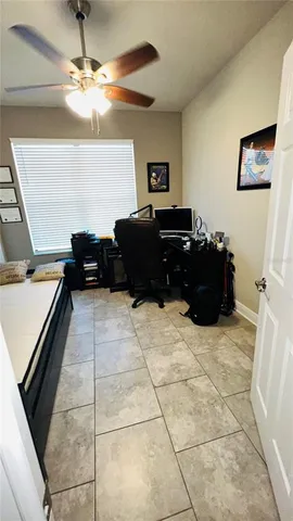 a living room with furniture and a dresser