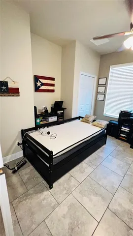 a living room with a bed and a couch