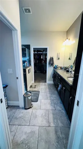 a kitchen with a sink and a stove top oven