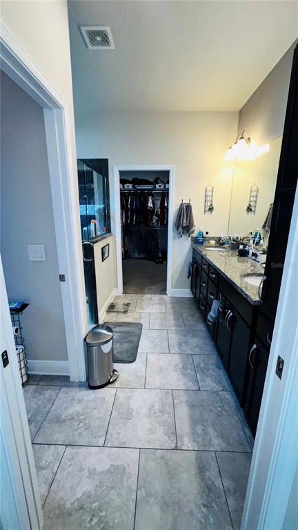 1597 West Caroline Path Lecanto, FL 34461 - Photo 19 of 28 a kitchen with a sink and a stove top oven