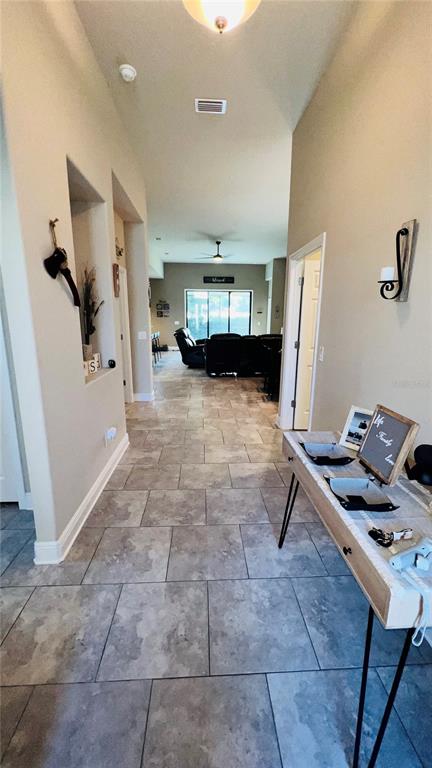1597 West Caroline Path Lecanto, FL 34461 - Photo 3 of 28 a view of a workspace with furniture and a window