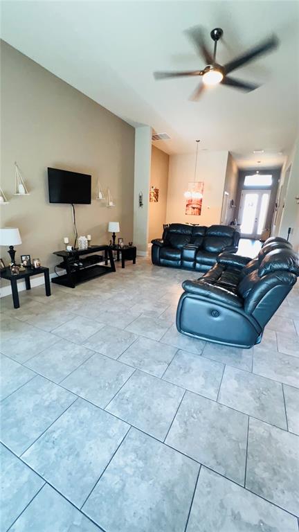 1597 West Caroline Path Lecanto, FL 34461 - Photo 6 of 28 a living room with furniture and a flat screen tv