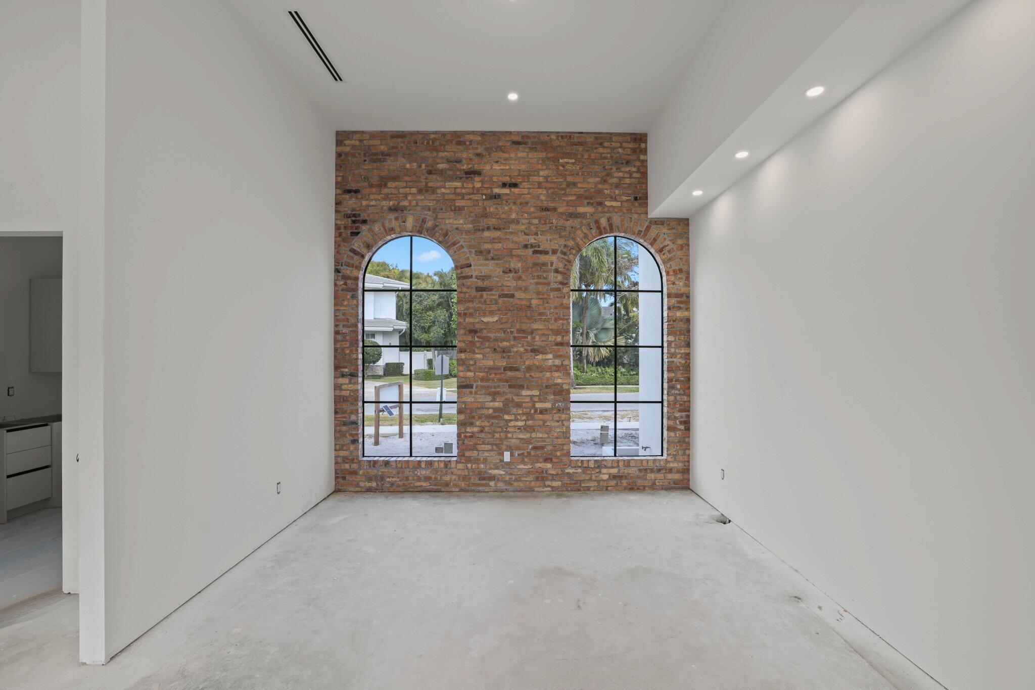 298 Northeast 8th Street Boca Raton, FL 33432 - Photo 12 of 48 an empty room with windows