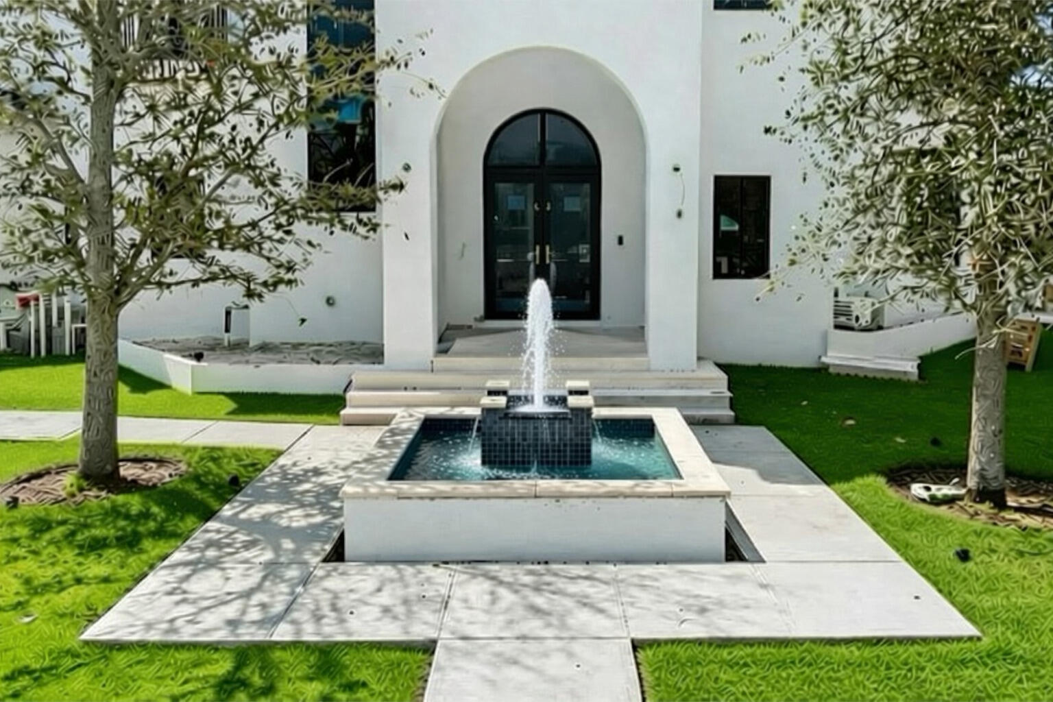 298 Northeast 8th Street Boca Raton, FL 33432 - Photo 4 of 48 a view of a house with brick walls and a yard with plants