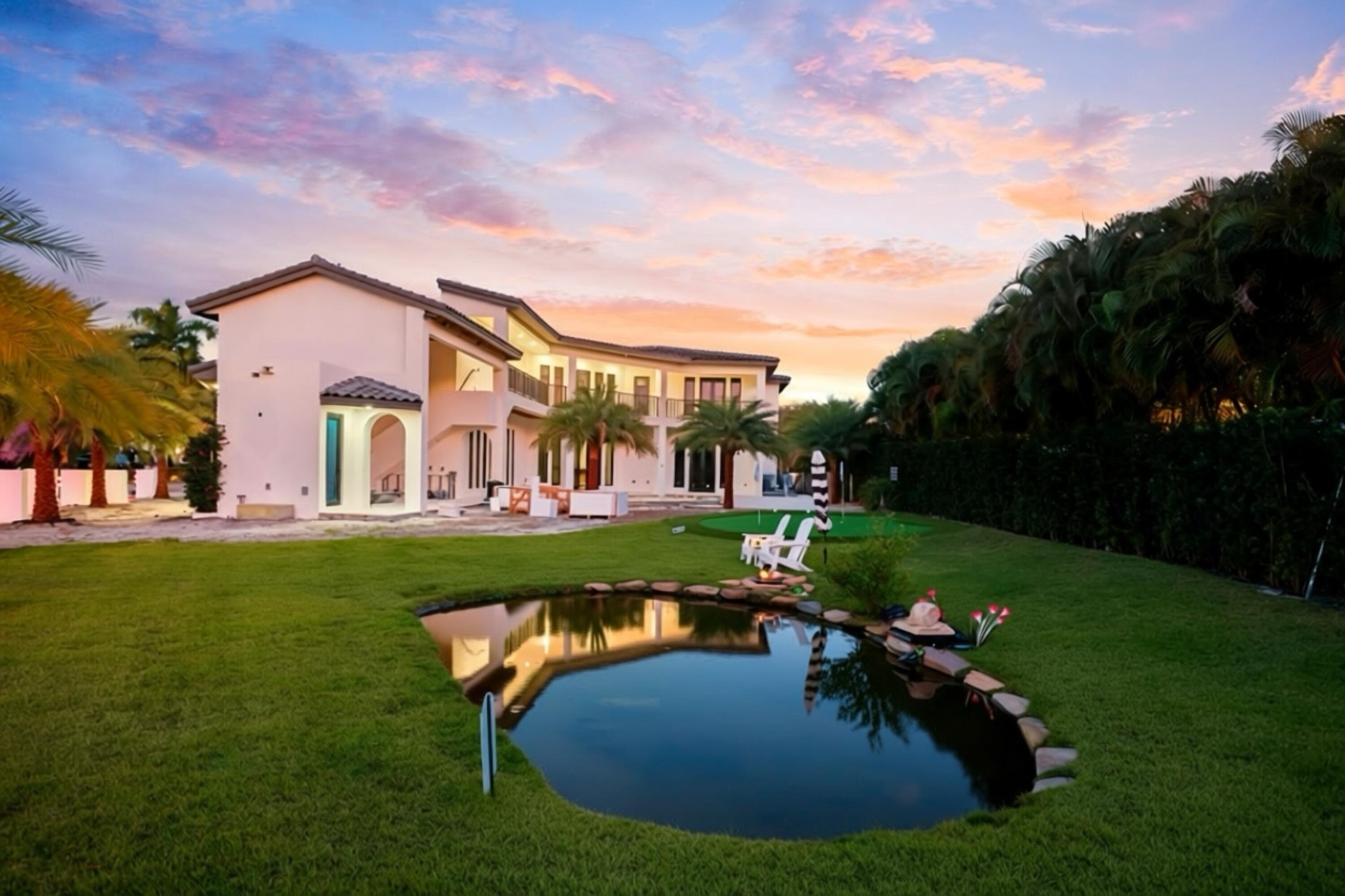 298 Northeast 8th Street Boca Raton, FL 33432 - Photo 41 of 48 a view of a house with a big yard plants and large trees