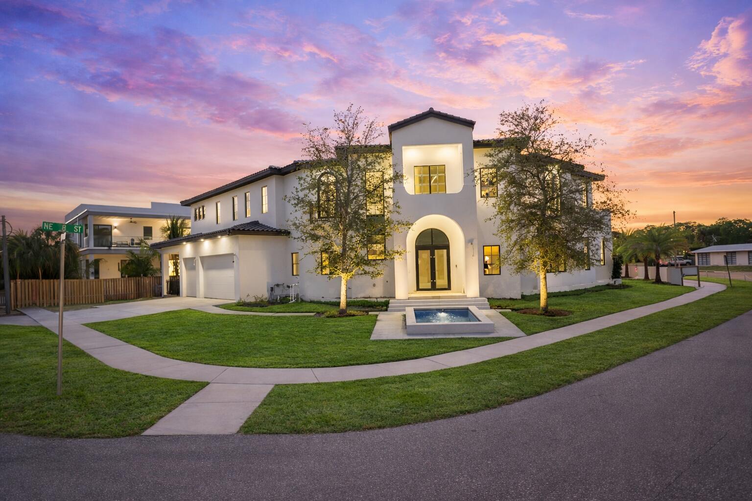 298 Northeast 8th Street Boca Raton, FL 33432 - Photo 42 of 48 a front view of a house with a yard
