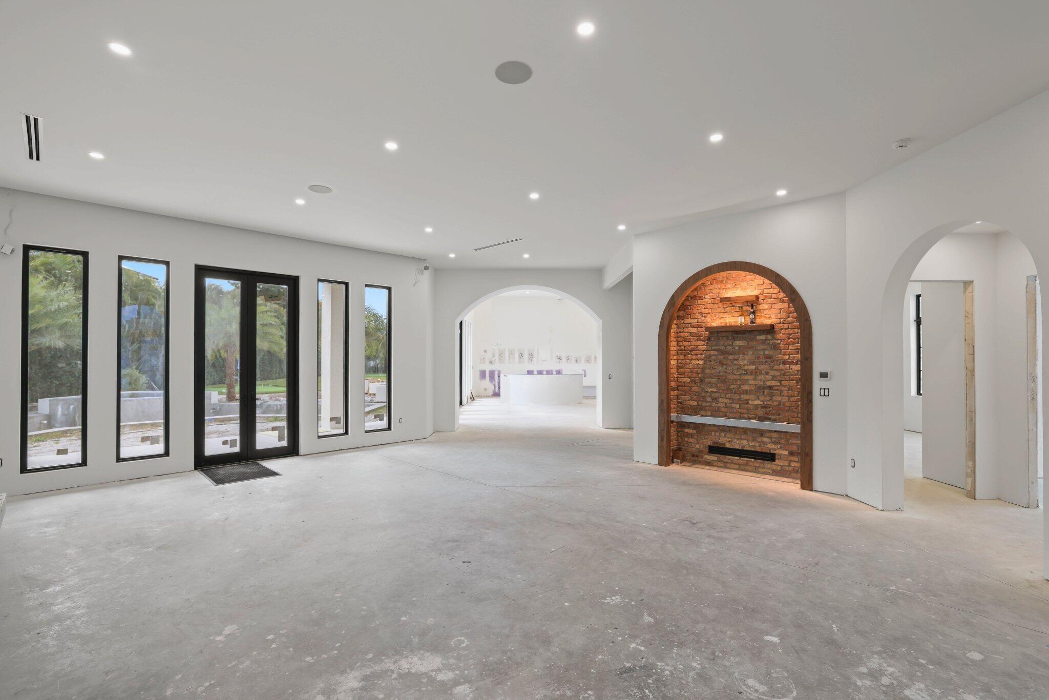 298 Northeast 8th Street Boca Raton, FL 33432 - Photo 6 of 48 a view of an empty room with a window and a fireplace