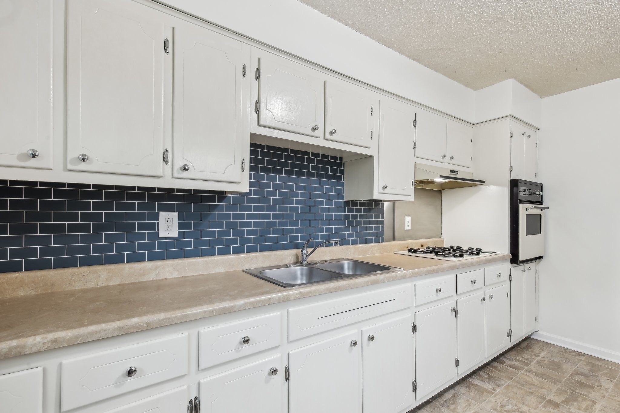 144 Airport Road Clarksville, TN 37042 - Photo 18 of 49 a kitchen with appliances a sink and cabinets