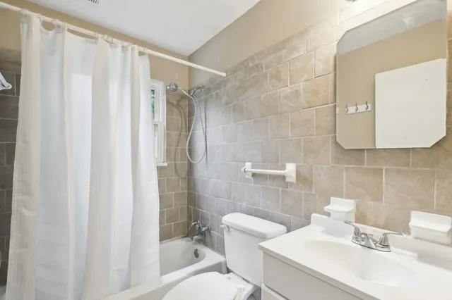 a bathroom with a toilet a sink and a shower