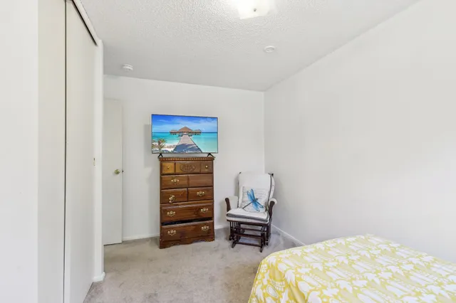 a bedroom with a bed and a cabinets