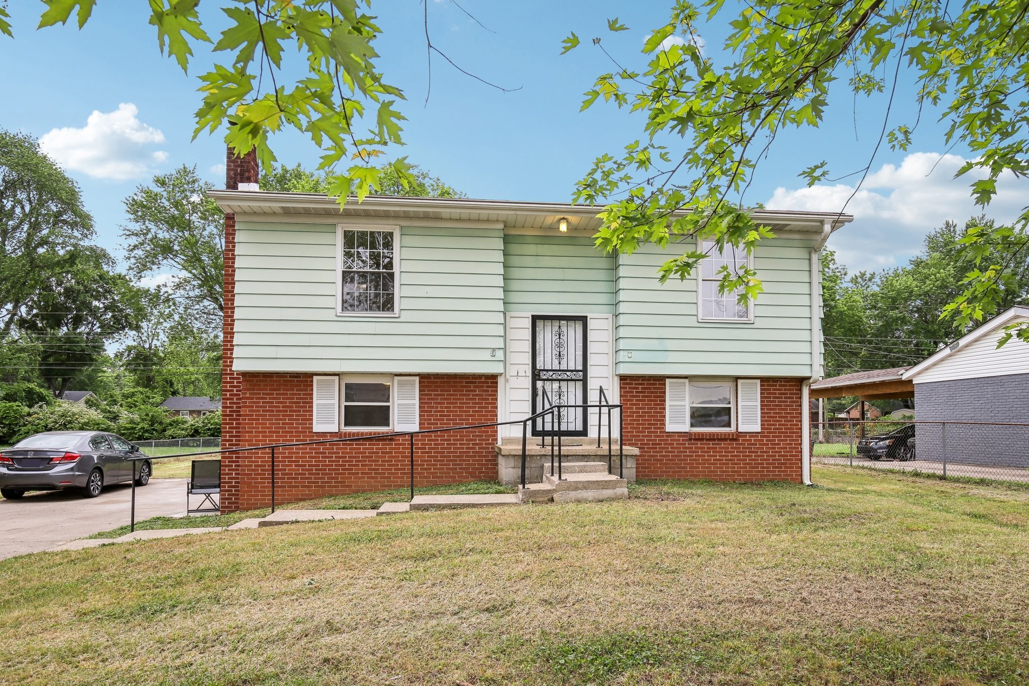 144 Airport Road Clarksville, TN 37042 - Photo 34 of 49 a front view of a house with a garden
