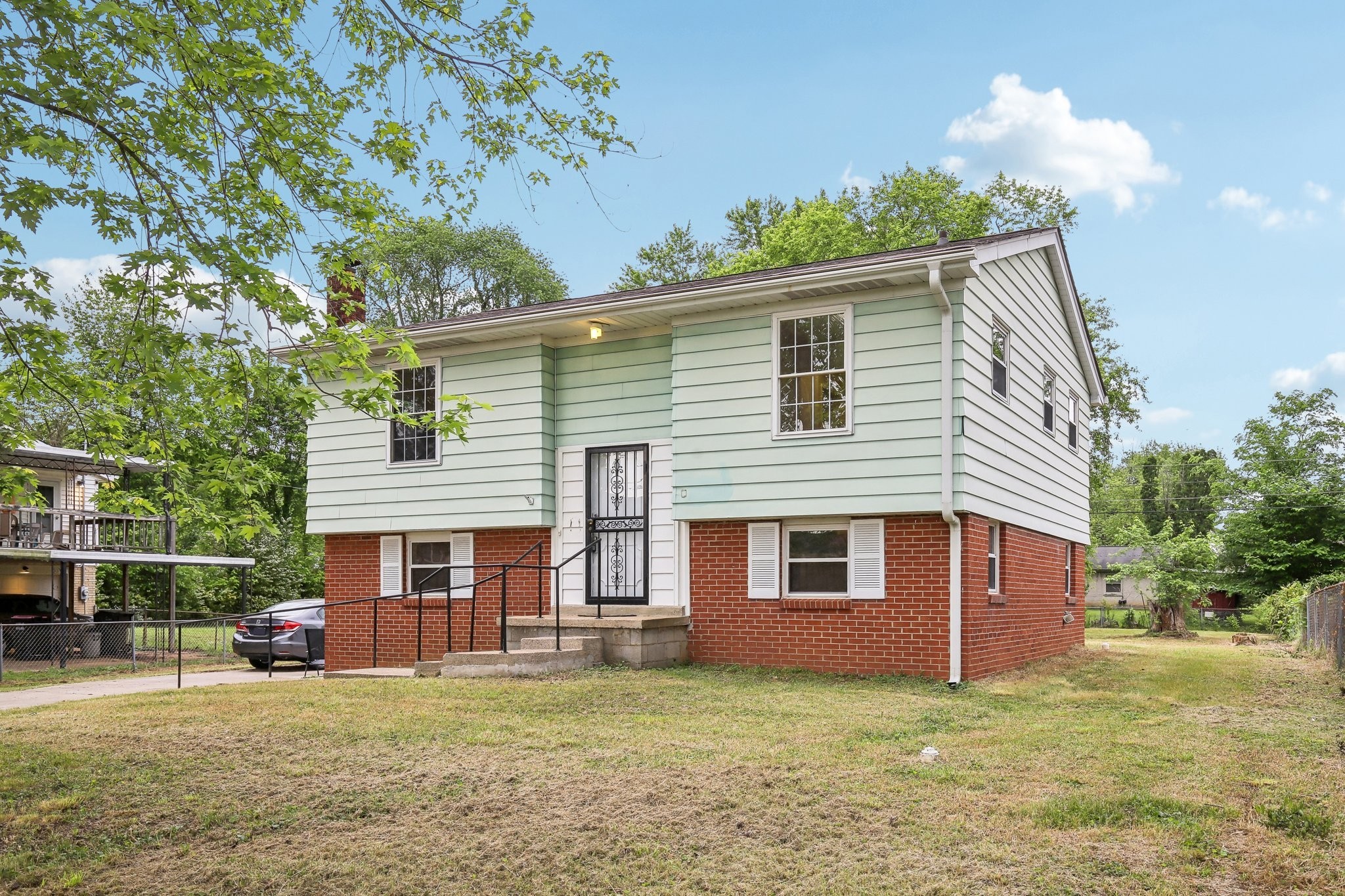 144 Airport Road Clarksville, TN 37042 - Photo 35 of 49 a front view of a house with a garden