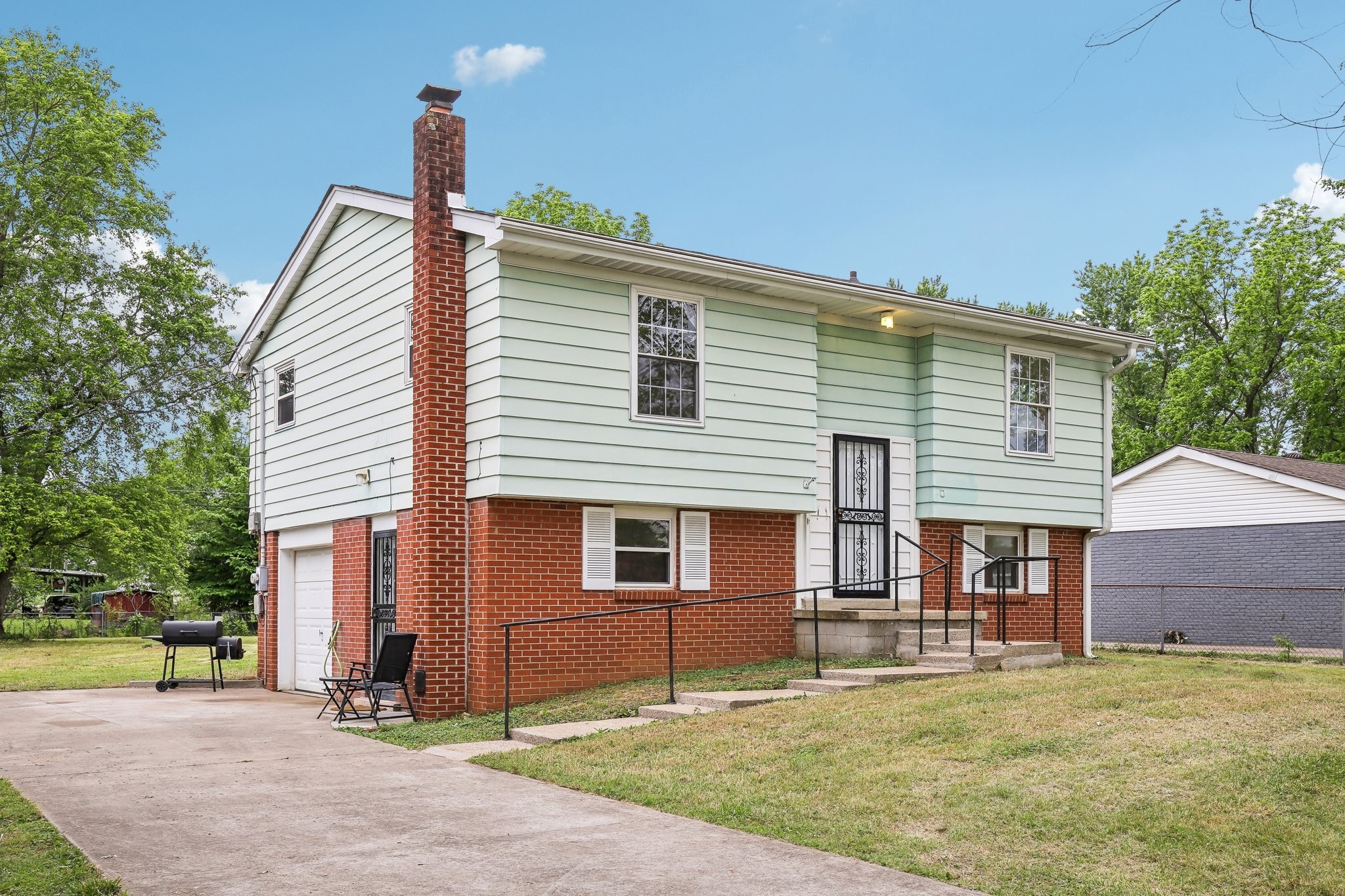 144 Airport Road Clarksville, TN 37042 - Photo 37 of 49 a view of a house with a backyard and a tree