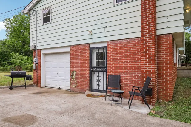 a backyard of a house with outdoor seating