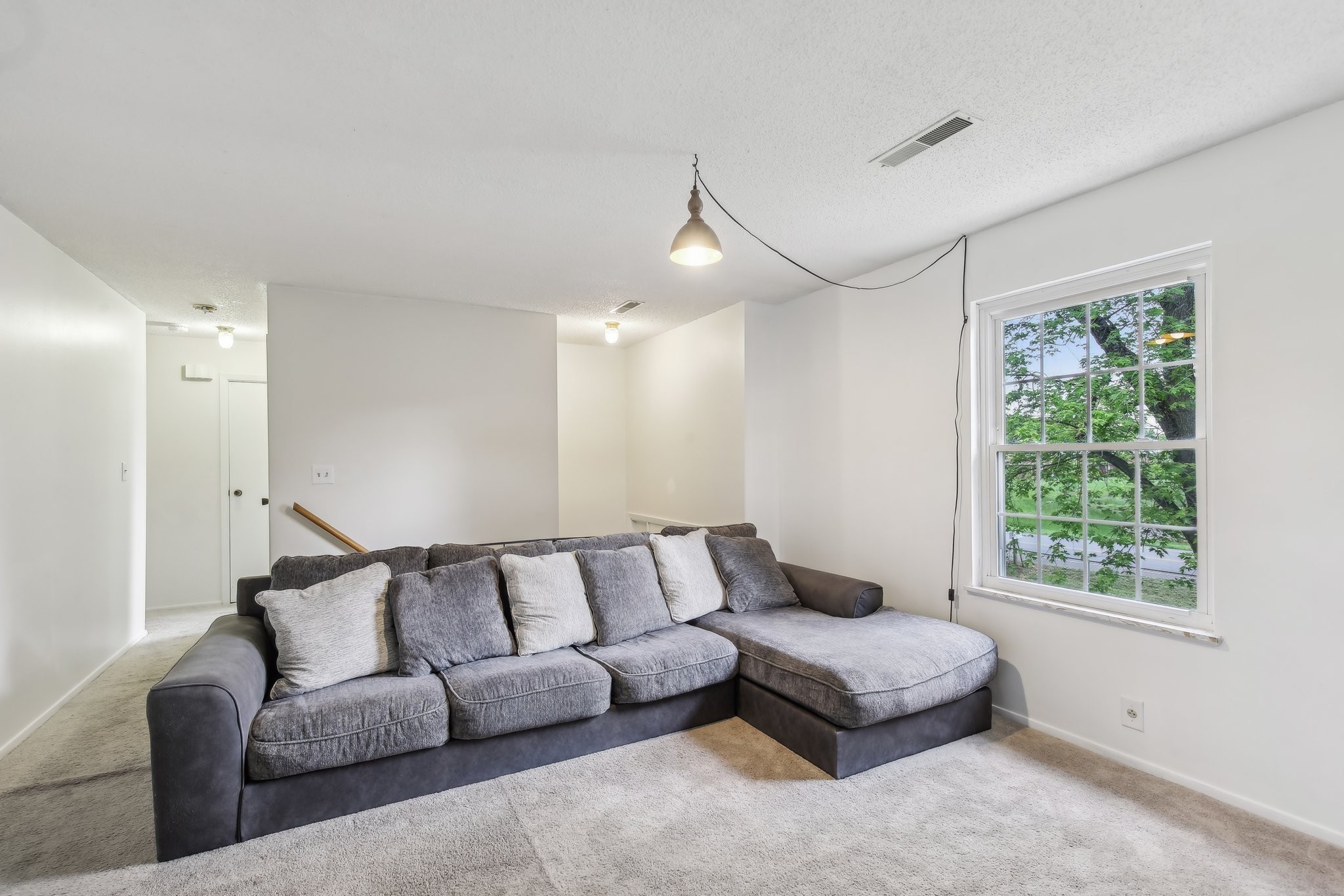 144 Airport Road Clarksville, TN 37042 - Photo 8 of 49 a spacious bedroom with a bed couch and window