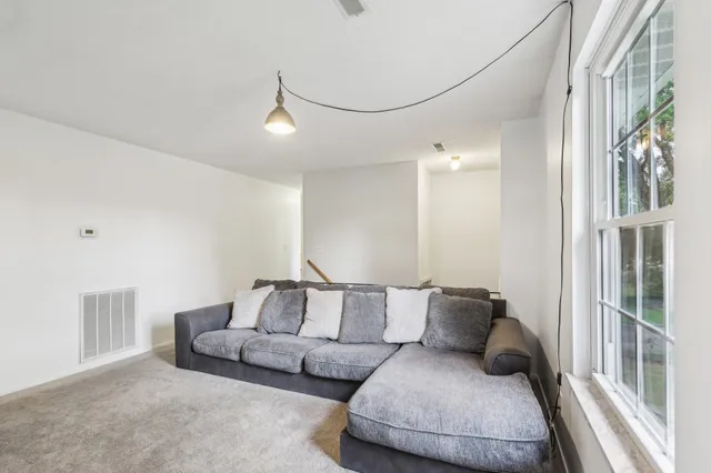 a living room with furniture and a couch