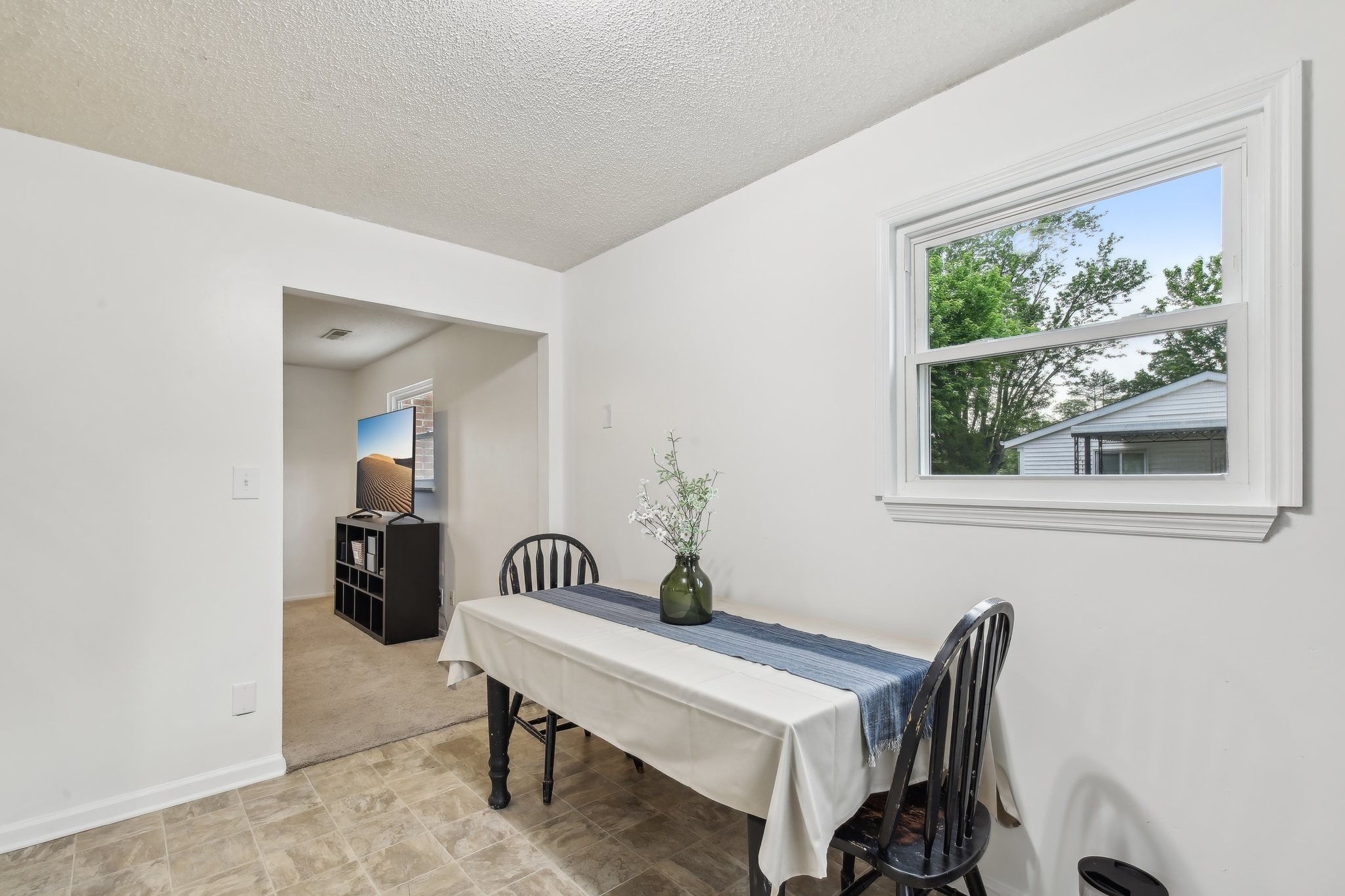 144 Airport Road Clarksville, TN 37042 - Photo 10 of 49 a view of a room that has a table and a chair