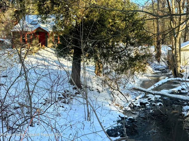 a view of road with large trees