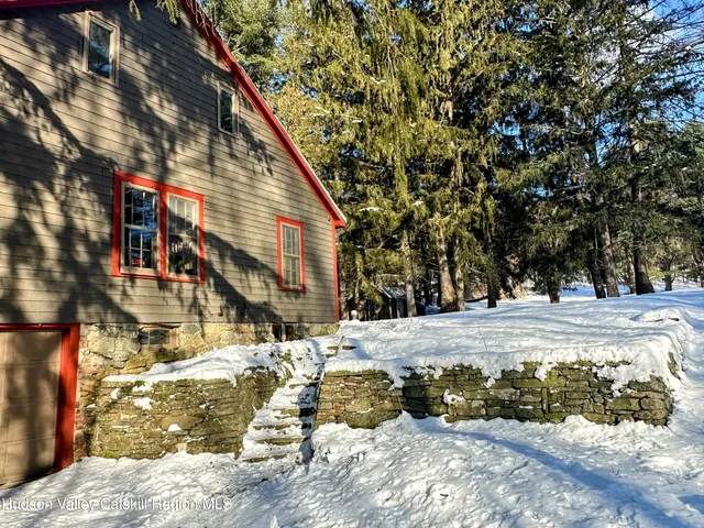 a wooden bench sitting in front of a building