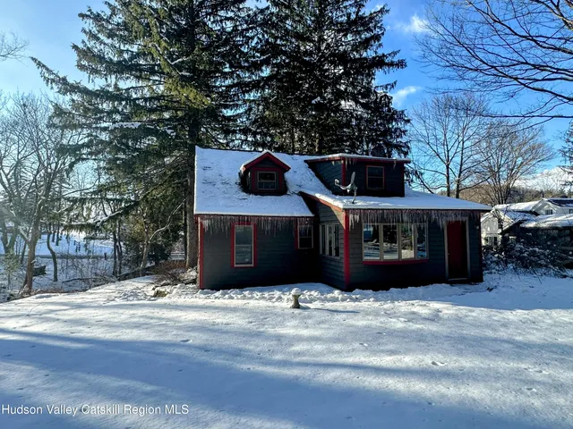 a view of a car park in front of house