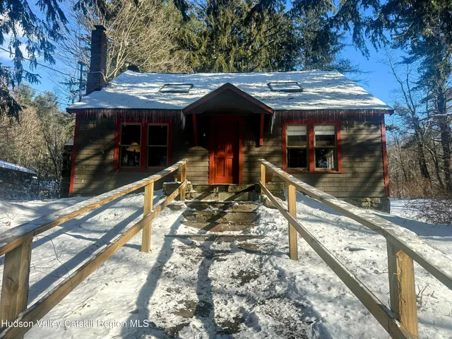 a view of a house with large windows