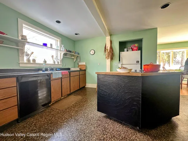 a kitchen with sink and cabinets