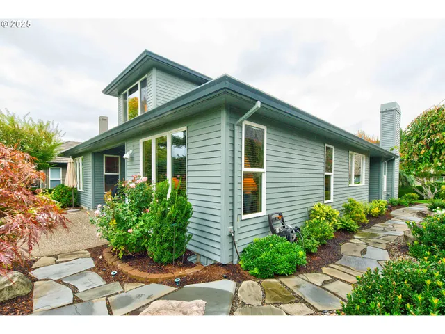 a front view of a house with garden