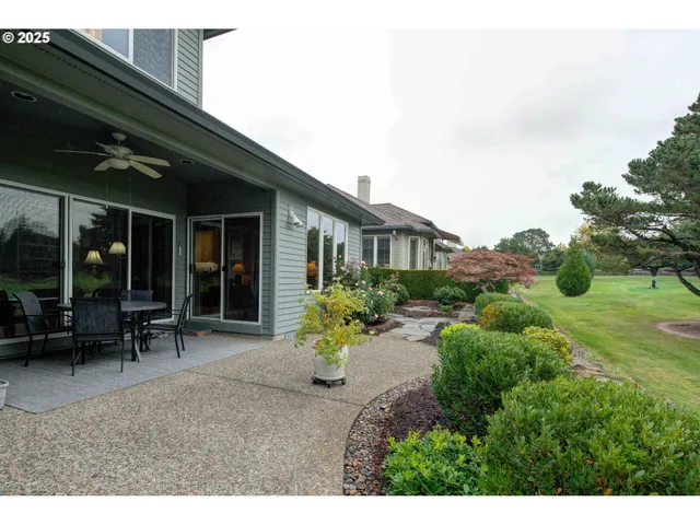 a backyard of a house with outdoor seating