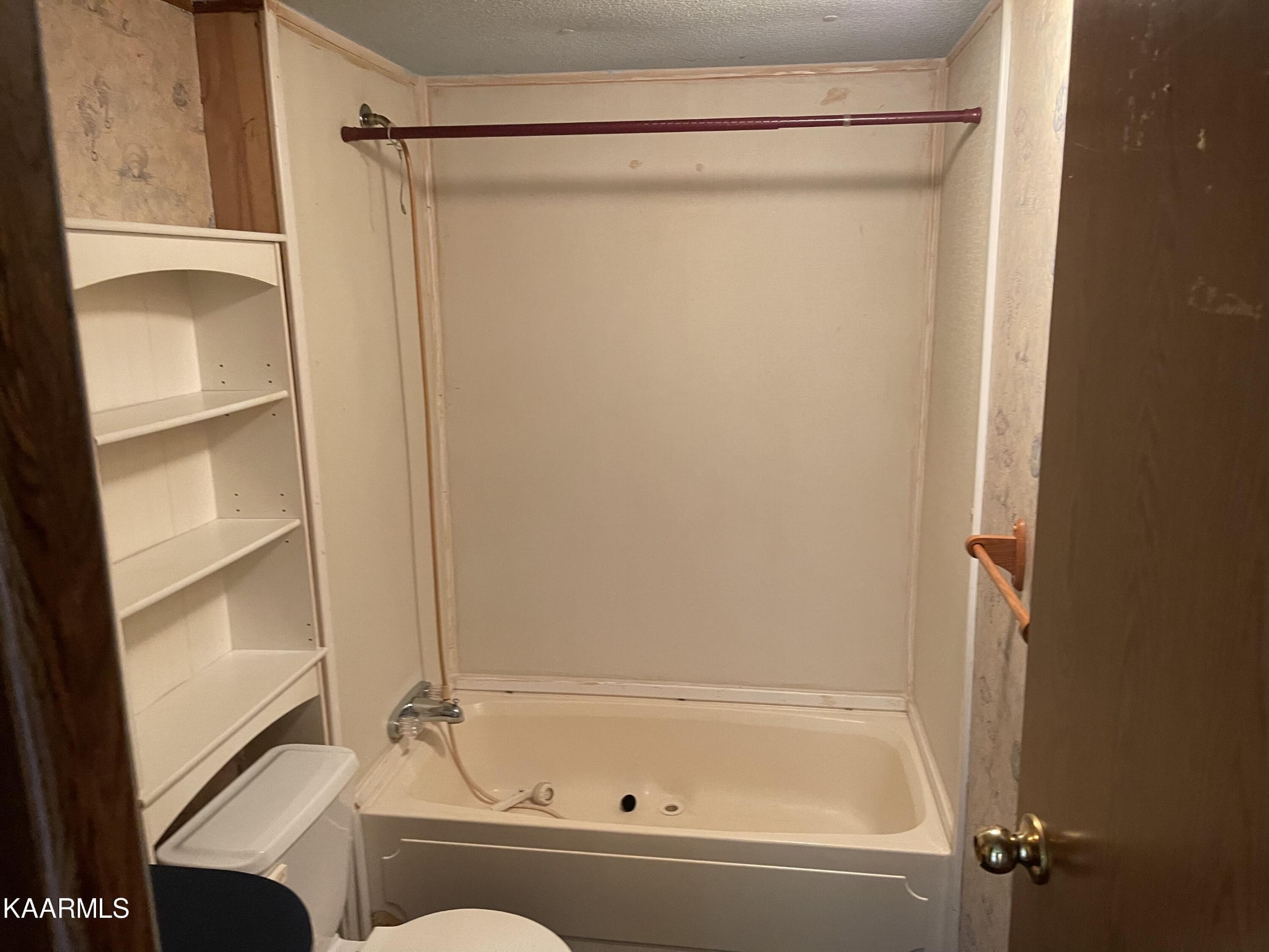 625 Miller Road Bybee, TN 37713 - Photo 18 of 34 a bathroom with a bathtub and a shower