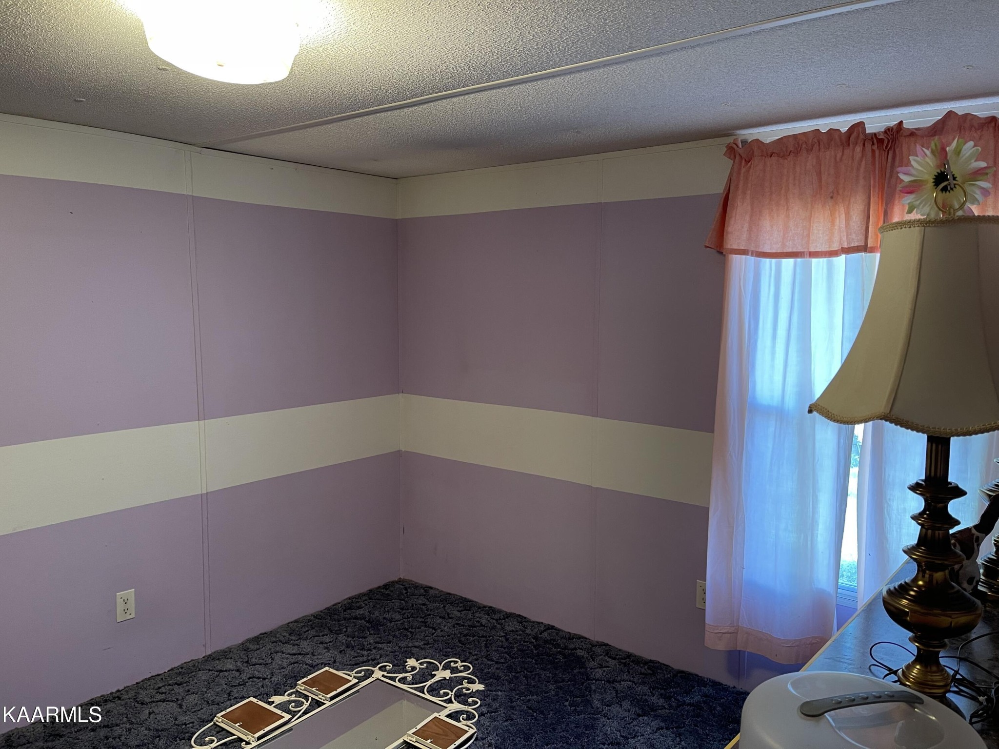 625 Miller Road Bybee, TN 37713 - Photo 19 of 34 a room with a chair and a lamp on the table
