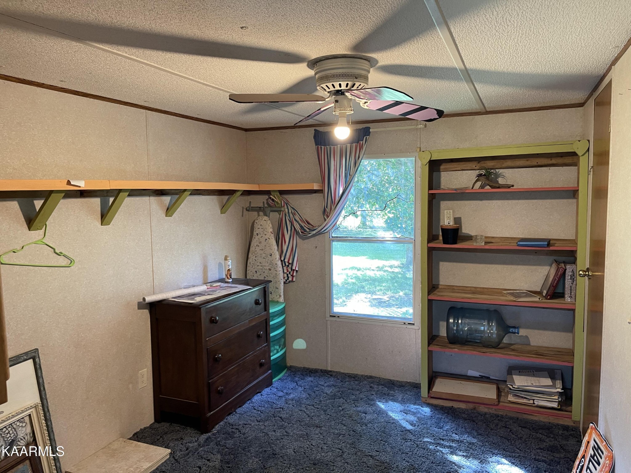 625 Miller Road Bybee, TN 37713 - Photo 20 of 34 a room with lots of wooden furniture and a window