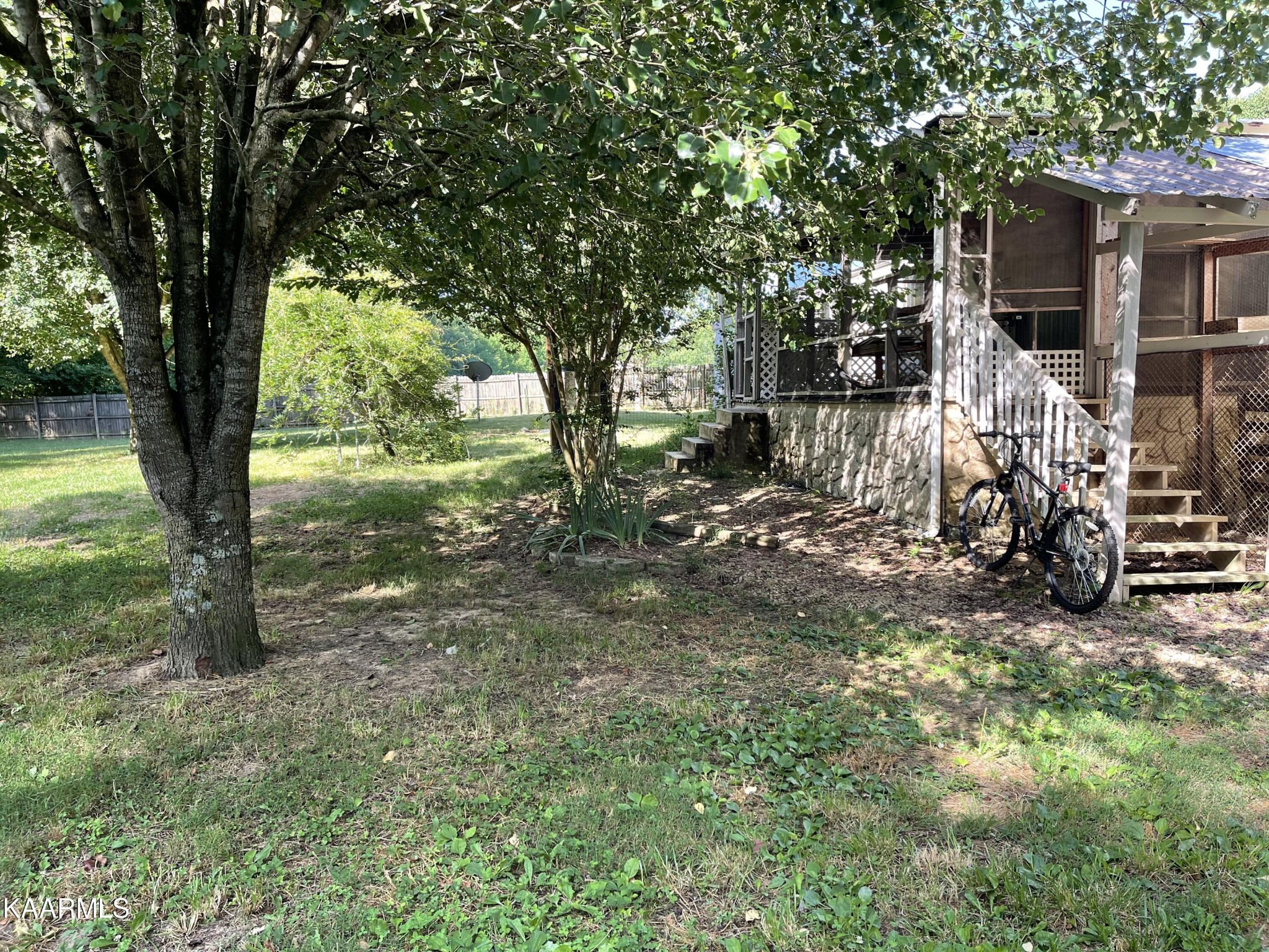 625 Miller Road Bybee, TN 37713 - Photo 32 of 34 a view of a tree in front of a house with large trees